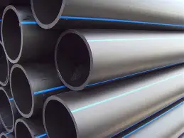 Black HDPE pipe with blue stripe for water supply, stacked industrial plastic pipe