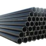 Stacked high-quality plastic HDPE/PE pipes with blue marking, industrial water supply pipe close-up