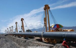 Workers installing HDPE drainage pipes for urban rain and sewage separation project