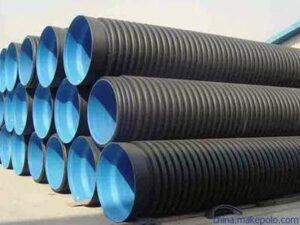 Black HDPE pipe bundles neatly stacked in a factory warehouse for bulk export to Europe, showing large-diameter plastic pipes.