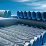 Assorted PPR pipe fittings and pipes displayed on a clean background, including elbows, tees, and straight connectors.
