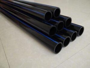 HDPE pipes stacked in factory warehouse for infrastructure projects