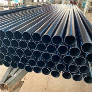 High-quality black HDPE and PE pipes stacked in a factory warehouse for water supply projects