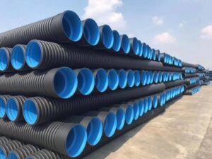 Black HDPE pipe coiled in bundles, high density polyethylene, for water supply, sewage and gas transportation.