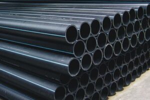 Green HDPE pipes stacked for overseas infrastructure projects